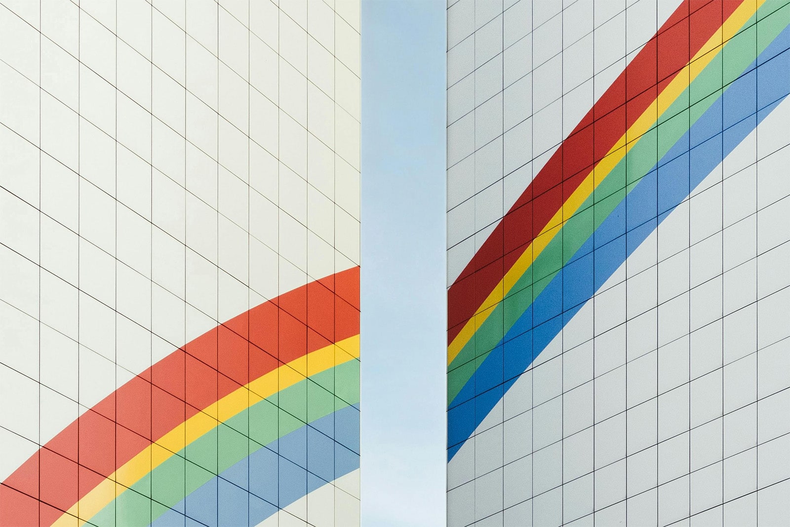 Illustration of rainbow reflected in skyscraper