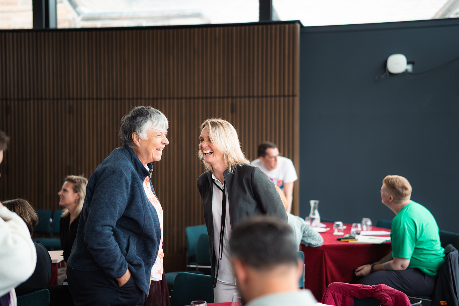 Networking event post-summit, showcasing collaborative dialogue among attendees.
